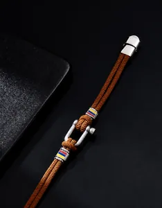 Macro detail of braided horse buckle bracelet with stainless steel magnetic clasp