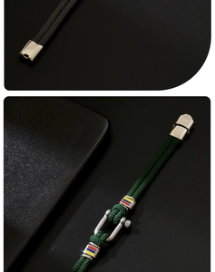 Detail of horseshoe clasp on woven nylon bracelet with vibrant enamel stripes