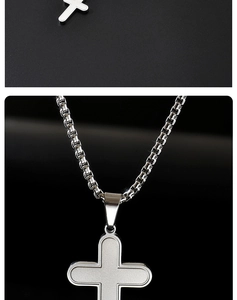 Detailed macro view of silver cross pendant with frosted finish and box chain