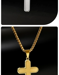 Macro shot of gold stainless steel cross pendant with frosted texture and square link chain