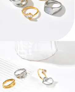 Detail view of gold and silver plated rings showing 8.52mm mother of pearl inlay and gemstone
