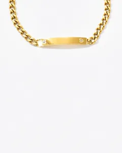 Detail of gold-plated Cuban chain bracelet with customizable polished nameplate and small zircons