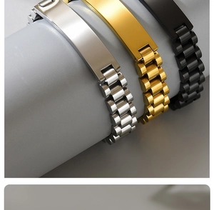 Detail of titanium steel bracelets in silver, gold, and black with polished link textures