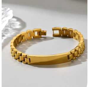 Detail view of gold-plated stainless steel watchband link bracelet with blank engraving plate