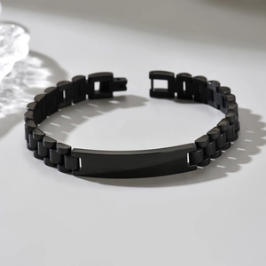 Men's matte black titanium steel bracelet with watch-style links and blank metal plate
