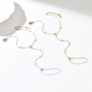Set bracciale ad anello a forma di Y in oro e argento con ciondoli a foglia piatti