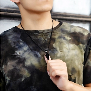Men's hip-hop black spearhead pendant necklace styled on a model with a beaded chain
