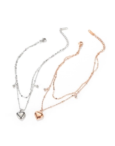 Macro detail of double-layered heart anklet with S925 engraving and gem inlay