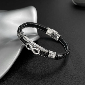Men's black braided leather infinity bracelet with polished silver metal accent