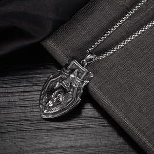 Vintage stainless steel shield pendant necklace featuring wolf and eagle embossed designs