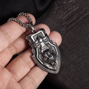 Vintage silver shield pendant with eagle and wolf totem on a stainless steel box chain