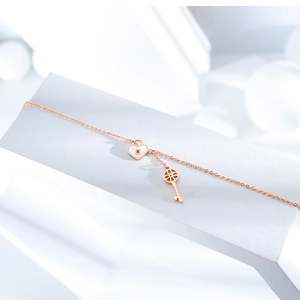Rose gold heart lock and key pendant necklace with white enamel inlay on minimalist base