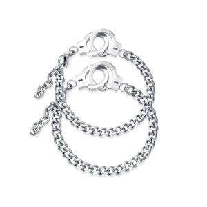 Matching silver stainless steel handcuff bracelets with engraved unlock charms for couples