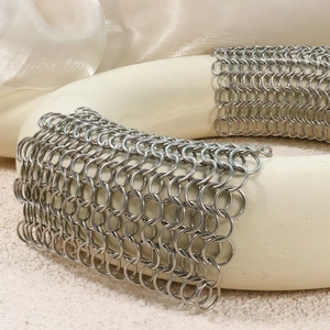 Industrial 304 stainless steel chainmail scrubber shown on a minimalist white stand