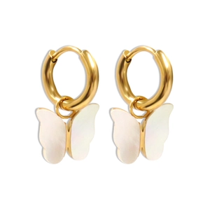 Close-up of golden butterfly drop earrings with iridescent shell texture finish