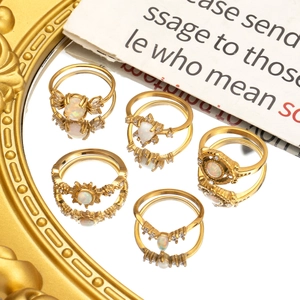 Bohemian gold sunburst ring set with opal stones and vintage floral engraved details