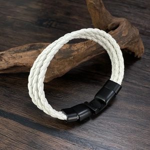 Detail of white multi-strand braided leather bracelet with black matte metal clasp