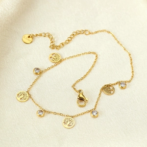 Golden stainless steel anklet featuring hollow tree of life charms and zircon accents