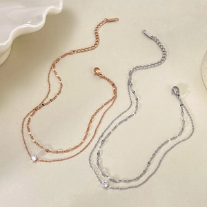 Bracelet de cheville double en acier titane avec zircone en or rose et argent