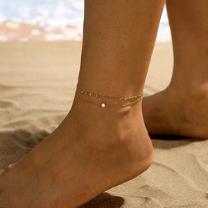 Bracelet de cheville double couche en titane doré avec zircon sur la plage