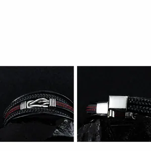 Macro shot of men's black braided leather bracelet with magnetic clasp and red stitching