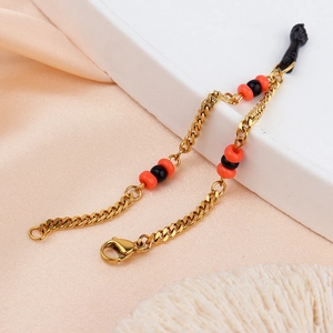 Bracelet gourmette en acier inoxydable plaqué or 18k avec pendentif poing et perles