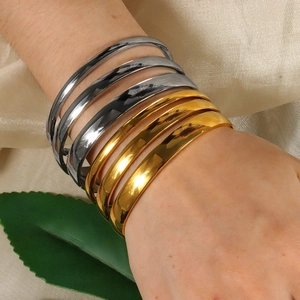 Minimalist polished stainless steel open bangle set in gold and silver finish for women