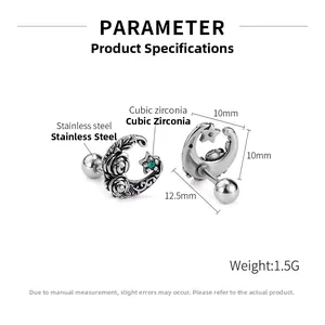 Macro detail of moon and rose stud earrings with green star zirconia in stainless steel
