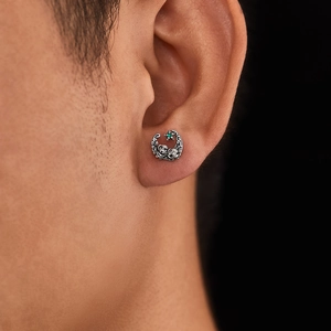 Vintage stainless steel rose earrings with green gemstone in a retro circular design