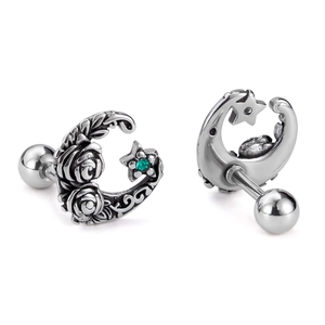Retro stainless steel rose moon stud earrings with green rhinestones on white background