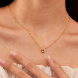 Gold plated stainless steel necklace featuring a zircon-encrusted O-letter pendant