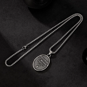 Detail of silver St. Michael protector pendant with engraved text and stainless box chain