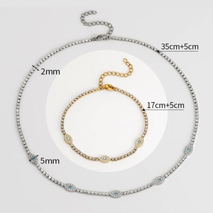 Tennis chain evil eye jewelry set with gold bracelet and silver necklace in macro view