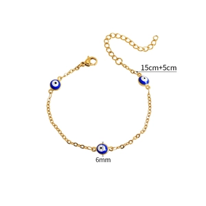 Bracciale bohémien dorato con ciondoli malocchio blu e chiusura a moschettone