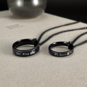 Close-up of His Queen and Her King black steel rings with crowns and tiny zircons