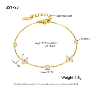 Detail of stainless steel bracelet with cubic zirconia charms and dimension markings