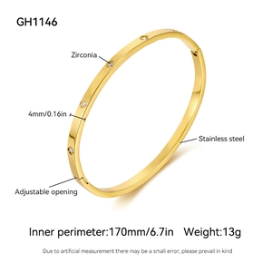Detail of 4mm gold stainless steel bracelet showing zirconia inlay and adjustable opening