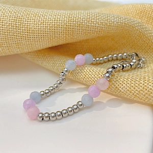 Detail of faceted morganite beads and silver stainless steel beads with lobster clasp