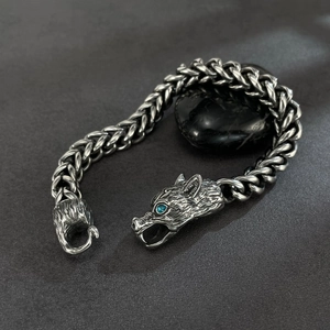 Retro wolf head bracelet for men featuring a blue gemstone eye and braided chain