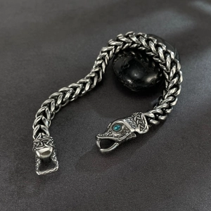 Retro punk stainless steel bracelet with snake head clasp and blue gemstone eyes