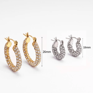 Orecchini a forma di U con finiture oro e argento e incastonatura completa di zirconi