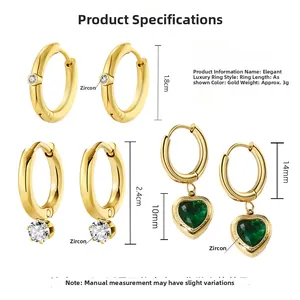 Detailed view of three 18K gold earrings sets with cubic zirconia and heart charms