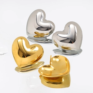Gepolijste 18K goud en zilver hartvormige oorknopjes met glanzende spiegelafwerking