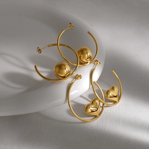 Minimalist gold stainless steel hoop earrings with heart and sphere charm pendants
