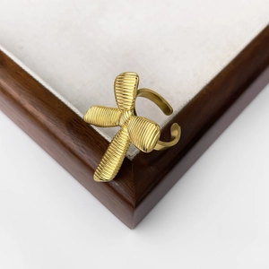 Vintage 18K gold plated titanium steel bow ring with textured finish and open band