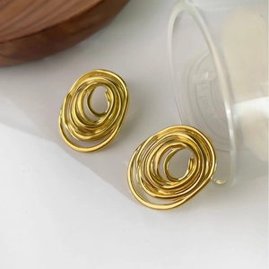 Pendientes de espiral dorados artísticos en acero de titanio pulido impermeable