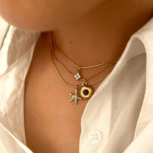 Triple-layered gold stainless steel necklace with starfish, flower, and disc pendants