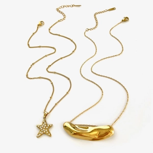 Golden stainless steel necklace set with sparkling star pendant and irregular bean charm