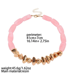 Pink resin cylinder necklace with irregular gold beads on a clean white background