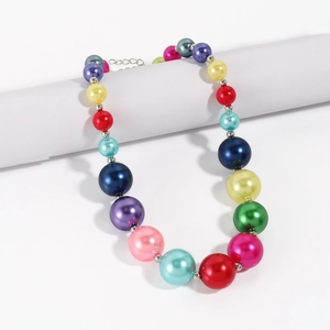 Macro shot of colorful oversized faux pearls necklace with silver lobster clasp